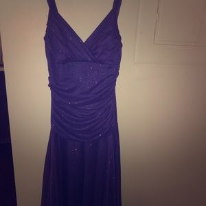A purple, sparkly, spaghetti strap dress.